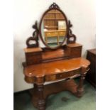 A VICTORIAN MAHOGANY DRESSING TABLE, THE OVAL FRAMED MIRROR ABOVE TWO BANKS OF THREE DRAWERS
