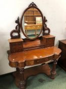 A VICTORIAN MAHOGANY DRESSING TABLE, THE OVAL FRAMED MIRROR ABOVE TWO BANKS OF THREE DRAWERS