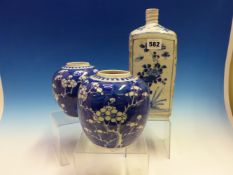 A EARLY. CHINESE BLUE AND WHITE SQUARE SECTIONED BOTTLE PAINTED WITH PANELS OF LOTUS,