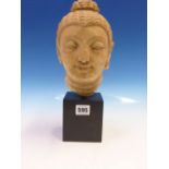 A COMPOSITION STONE HEAD OF THE BUDDHA IN SUKHOTHAI STYLE AND MOUNTED ON A SQUARE BLACK BASE. H