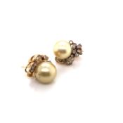 A PAIR OF SOUTH SEA CULTURED PEARL AND TAPERED BAGUETTE AND ROUND BRILLIANT CUT DIAMOND EARRINGS.