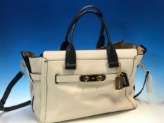 A COACH NEW YORK CREAM AND BLACK LARGE LEATHER HANDBAG WITH DUSTBAG.
