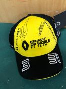 FORMULA 1 RENAULT- A YELLOW SIGNED CAP SIGNED BY DANIEL RICARDO AND ESTABAN OCON TO BE SOLD IN SUP