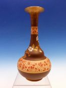 A DOULTON BOTTLE VASE, THE BROWN TRUMPET NECK POWDERED WITH GOLD ABOVE TWO RED CHERRY BLOSSOM