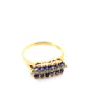 A 18ct GOLD HALMARKED VINTAGE SAPPHIRE AND DIAMOND HORIZONTAL CLUSTER RING. DATED 1991, SHEFFIELD.