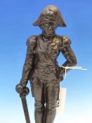 A NELSON CAST IRON DOOR STOP, HE STANDS WITH HIS LEFT HAND ON HIS HIP AND A DRAWN SWORD IN HIS