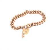AN OLD ROSE GOLD CHARM BRACELET COMPLETE WITH A YELLOW GOLD 9ct HALLMARKED PADLOCK CLASP AND