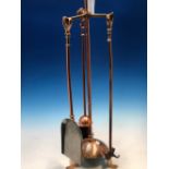 AN ARTS AND CRAFTS COPPER COMPANION SET, THE BRUSH POKER AND SHOVEL WITH HEART SHAPED HANDLES