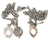 AN ANTIQUE SILVER DOUBLE ALBERT WATCH CHAIN COMPLETE WITH A SILVER FOB AND T-BAR, LENGTH 56cms,