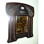 A BEVELLED GLASS RECTANGULAR MIRROR WITHIN A RUSSIAN ART NOUVEAU MAHOGANY FRAME CHIP CARVED WITH