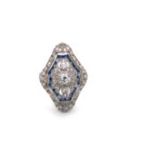 A VICTORIAN STYLE DIAMOND AND SAPHIRE DRESS RING, THREE PRINCIPLE OLD CUT DIAMONDS WITHIN SHAPED