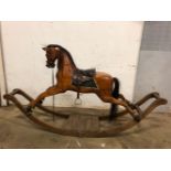A RESTORED 19th C. WOOD ROCKING HORSE WITH REAL HAIR MANE AND TAIL, LEATHER SADDLE AND BRIDLE. H 10