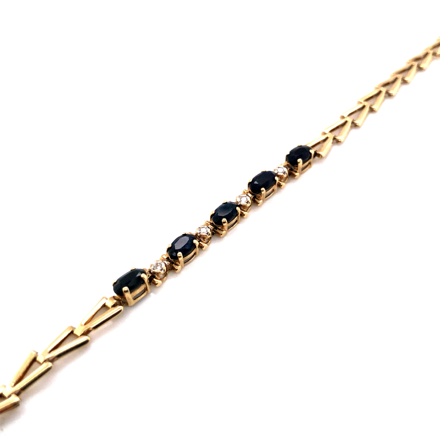 A HALLMARKED 9ct YELLOW GOLD SAPPHIRE AND CUBIC ZIRCONIA LINE BRACELET. FIVE OVAL SAPPHIRES IN A - Image 3 of 3