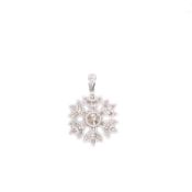 A 9ct WHITE GOLD AND DIAMOND SNOW FLAKE PENDANT. APPROX DIAMOND WEIGHT 2.37cts. MEASUREMENTS 4.5 X