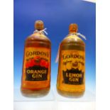 A VINTAGE BOTTLE OF GORDONS ORANGE GIN AND ANOTHER OF LEMON GIN
