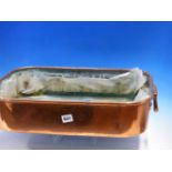 AN ANTIQUE ROUNDED RECTANGULAR TWO HANDLED COPPER JAM PAN WITH A REMOVABLE LINER. 54 x 39cms.