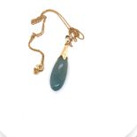 A JADE BOMBE DROP PENDANT WITH A SHAPED CAP AND BAIL, SUSPENDED ON AN 45cms CURB CHAIN. THE