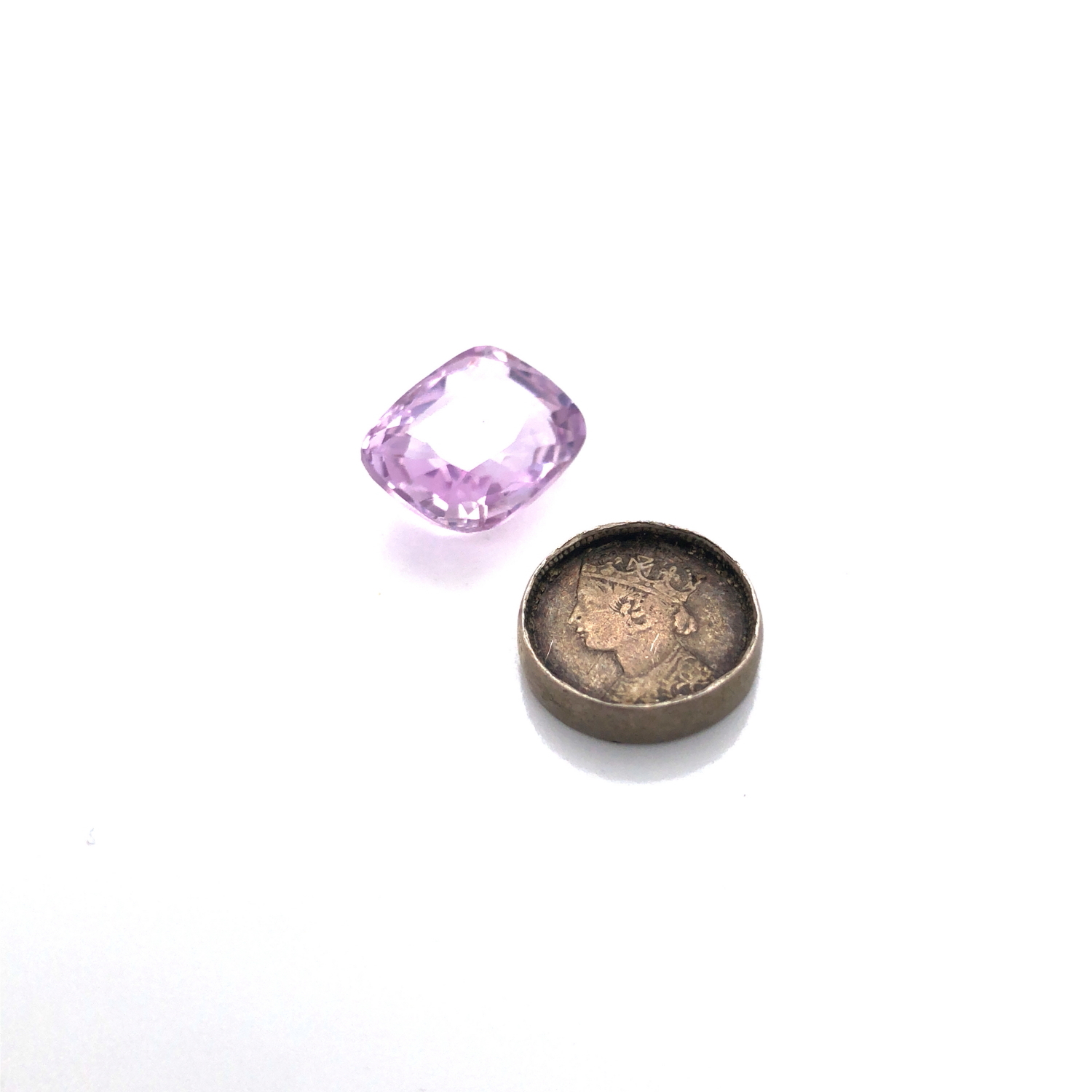 AN ANTIQUE FACET CUT LOOSE PINK SAPPHIRE, APPROX 13mm X 10mm, WEIGHT APPROX 6.26cts. TOGETHER WITH A