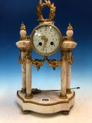 AN ORMOLU MOUNTED FOUR COLUMN PORTICO CLOCK, THE ENAMEL DIAL WITH FLORAL SWAGS BETWEEN THE ARABIC