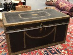 A BRASS CLOSE NAILED BLACK LEATHER COVERED CAMPHOR WOOD TRUNK WITH BRASS EDGING AND WITH TWO