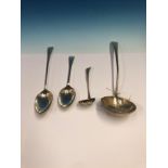 A LARGE GEORGIAN HALLMARKED SILVER LADLE,LONDON 1799 TOGETHER WITH A BASTING SPOON LONDON 1793, A