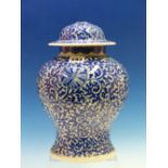 A CHINESE BLUE AND WHITE BALUSTER JAR AND COVER DECORATED OVERALL WITH SCROLLING LOTUS. H 30cms.