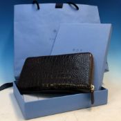A SMYTHSON BROWN CROC EMBOSSED LEATHER MARA PURSE AS NEW WITH BOX AND GIFT BAG.