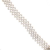 AN 18ct HALLMARKED WHITE GOLD RUBOVER SET MULTI DIAMOND BRACELET. THE BRACELET CONSISTING OF 118