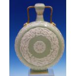 A ROYAL WORCESTER TWO HANDLED MOON FLASK, THE PALE GREEN CELADON BODY OVER DECORATED IN WHITE WITH