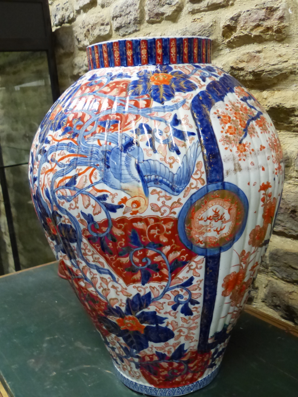 A LARGE JAPANESE IMARI RIBBED OVOID JAR PAINTED WITH CHERRY TREES IN BLOSSOM ALTERNATING WITH PHOENI - Image 6 of 10