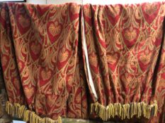 A PAIR OF LINED WOOL CURTAINS WITH ART NOUVEAU FLOWERS ON THE RED GROUND