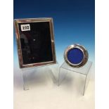 TWO HALLMARKED SILVER PHOTO FRAMES, ONE CIRCULAR 9cm DIAMETER AND THE SECOND RECTANGULAR 14cm X 18cm