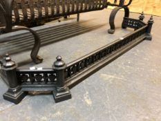 A 19th C. IRON FIRE KERB WITH FOUR DECORATIVE KNOBS RAISED ABOVE SIDES PIERCED WITH BANDS OF