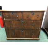 A GEORGIAN AND LATER LINE INLAID WALNUT CHEST OF TWO SHORT AND TWO LONG DRAWERS ABOVE PEG FEET. W 92