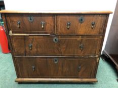 A GEORGIAN AND LATER LINE INLAID WALNUT CHEST OF TWO SHORT AND TWO LONG DRAWERS ABOVE PEG FEET. W 92