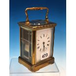 A FRENCH CARRIAGE CLOCK STRIKING ON A COILED ROD. H 14cms.