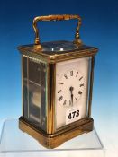 A FRENCH CARRIAGE CLOCK STRIKING ON A COILED ROD. H 14cms.