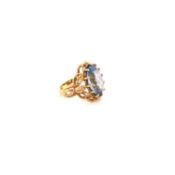 A SYNTHETIC BLUE SPINEL WOVEN ROPE DESIGN OVAL FACETED DRESS RING. FINGER SIZE M. WEIGHT 7.64grms.
