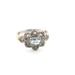 A HALLMARKED 9ct WHITE GOLD AQUAMARINE AND DIAMOND DRESS RING. FINGER SIZE S. WEIGHT 3.79grms.