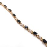 A HALLMARKED 9ct YELLOW GOLD, SAPPHIRE AND DIAMOND LINE BRACELET. LENGTH 18.5cms. WEIGHT 8.70grms.