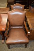 PAIR OF REPRODUCTION OAK LEATHER UPHOLSTERED CARVER CHAIRS