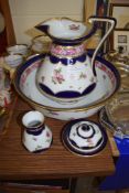 JUG AND BASIN SET BY GEORGE JONES TOGETHER WITH A SOAP DISH AND COVER AND A SMALL VASE