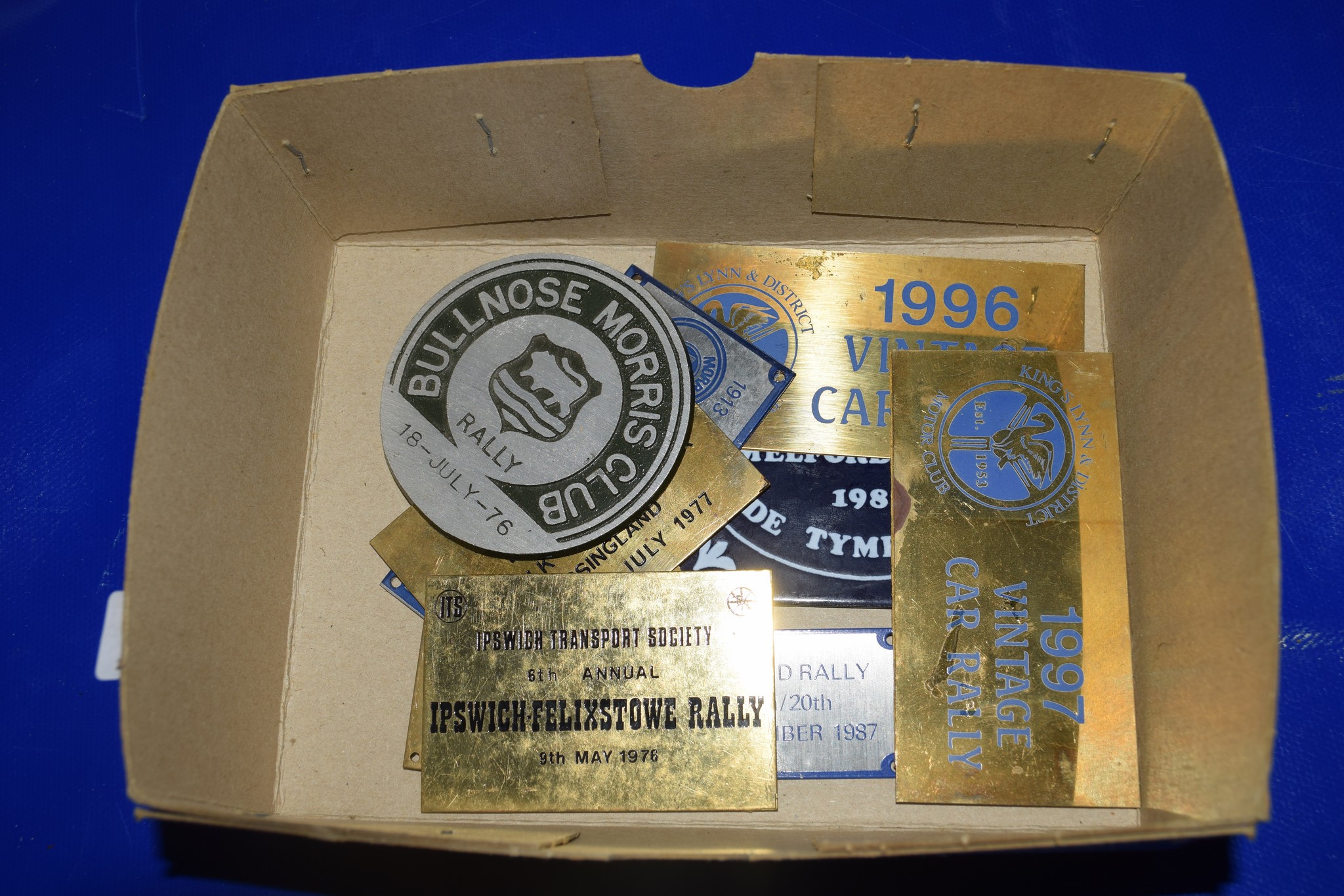 BOX CONTAINING VINTAGE CAR RALLY BADGES