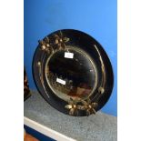 CIRCULAR WALL MIRROR WITH BLACK FRAME AND FLOWERS MODELLED IN RELIEF