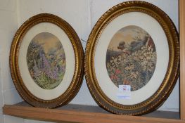 TWO PICTURES OF FLOWERS IN OVAL GILT FRAMES