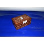 CARVED WOODEN BOX CONTAINING A QUANTITY OF COINS OF MEDALS INCLUDING COMMEMORATIVE CROWNS AND