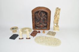 Group of carvings together with an interesting carving of a dragon slaying a man, in oak frame