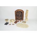 Group of carvings together with an interesting carving of a dragon slaying a man, in oak frame