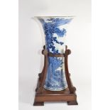 Large flared Chinese porcelain vase decorated with flowers and a landscape scene within a wood and
