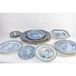 Group of 12 various blue and white platters and plates including a dish in the Gothic ruins pattern,